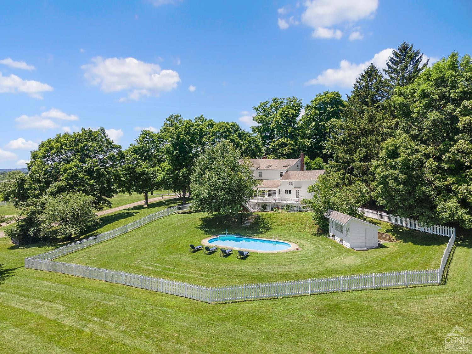 7 Thomas Road Chatham, NY 12184 - Photo 4 of 25 a house with trees in the background