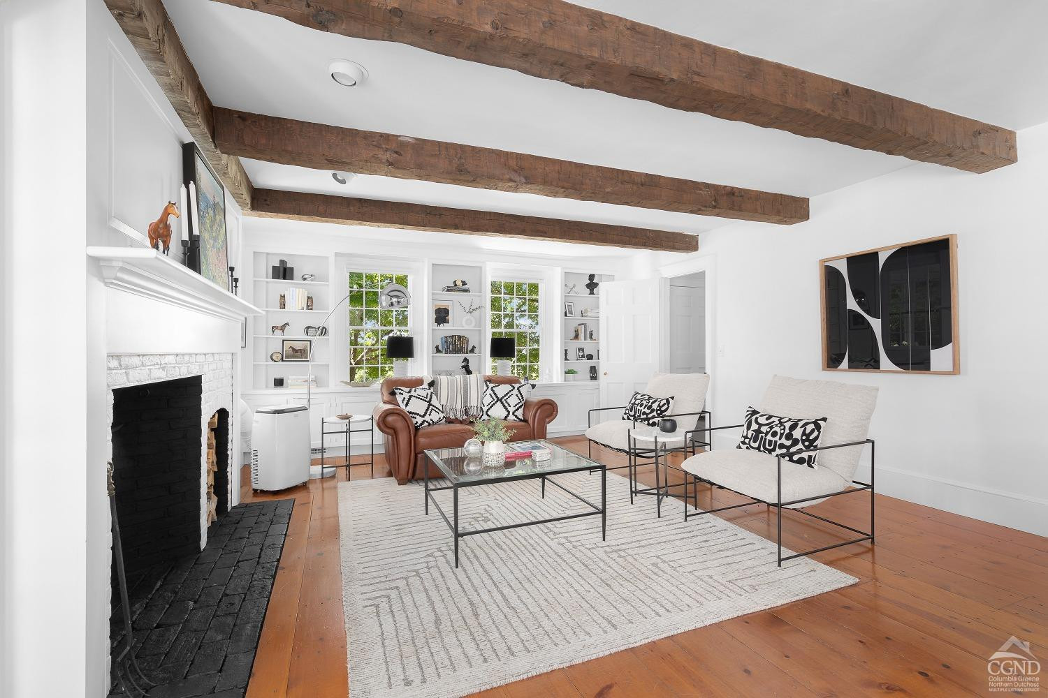 7 Thomas Road Chatham, NY 12184 - Photo 7 of 25 a living room with furniture and a fireplace