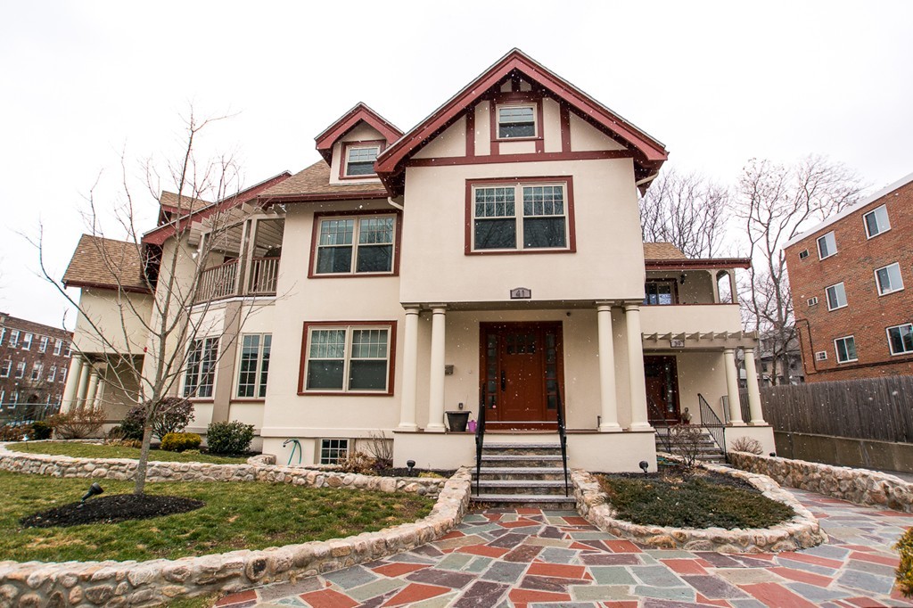 a front view of a house with yard
