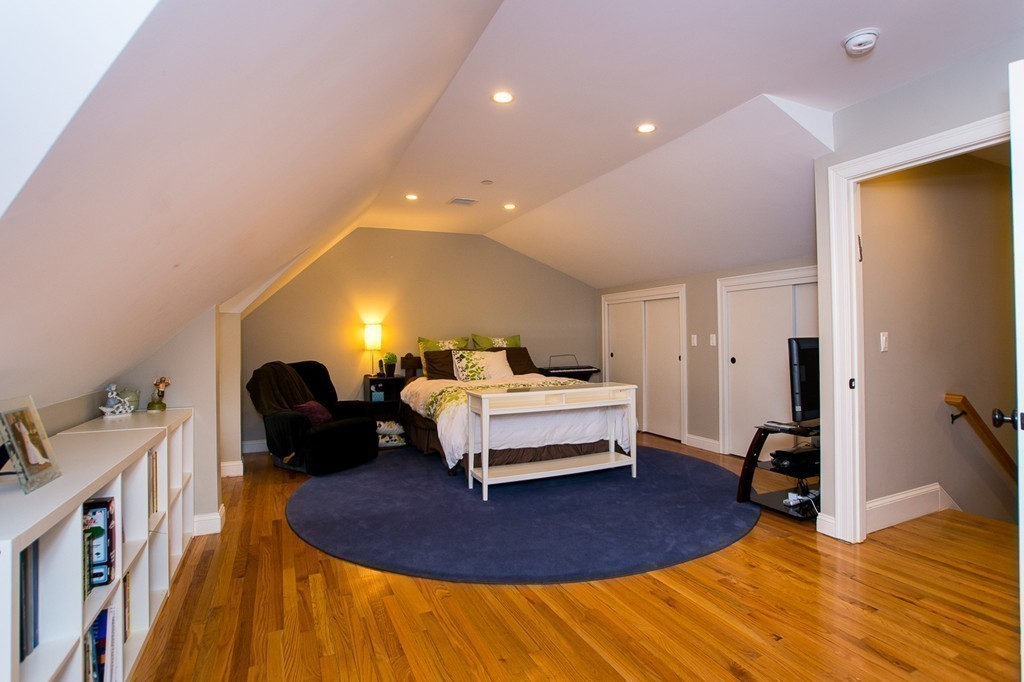 45 Selkirk Road, Unit C Boston, MA 02135 - Photo 15 of 19 a living room with furniture and a wooden floor