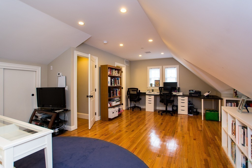 45 Selkirk Road, Unit C Boston, MA 02135 - Photo 16 of 19 a living room with furniture pool table and a flat screen tv