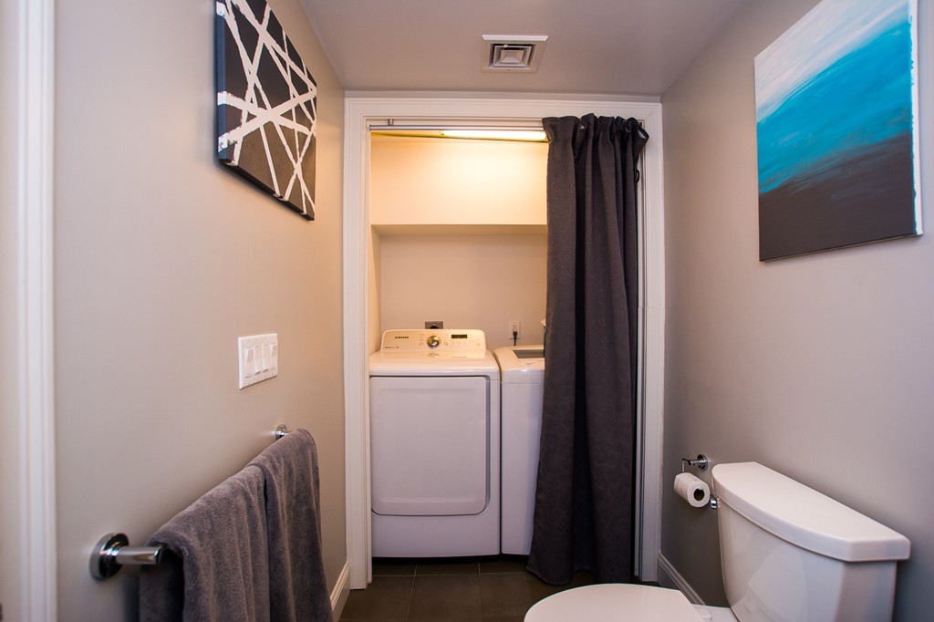 45 Selkirk Road, Unit C Boston, MA 02135 - Photo 17 of 19 a bathroom with a toilet sink and mirror