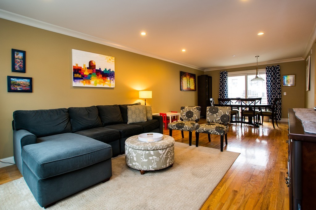 45 Selkirk Road, Unit C Boston, MA 02135 - Photo 3 of 19 a living room with furniture and wooden floor