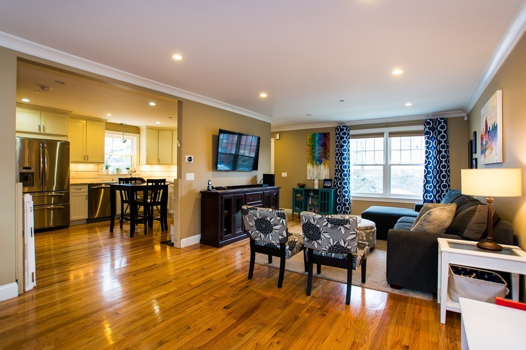 45 Selkirk Road, Unit C Boston, MA 02135 - Photo 4 of 19 a living room with furniture dining room and wooden floor