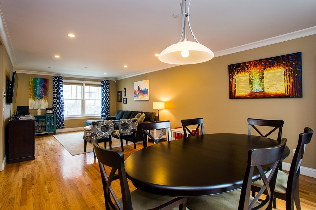 45 Selkirk Road, Unit C Boston, MA 02135 - Photo 5 of 19 a view of a dining room with furniture and wooden floor