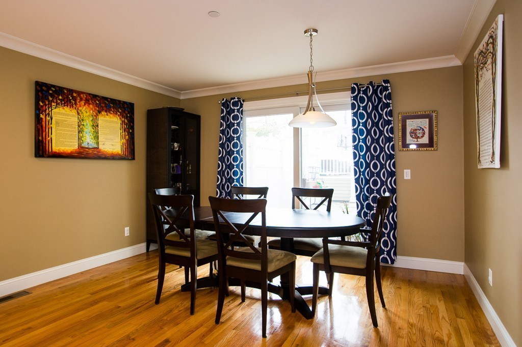 45 Selkirk Road, Unit C Boston, MA 02135 - Photo 6 of 19 a view of a dining room with furniture window and wooden floor