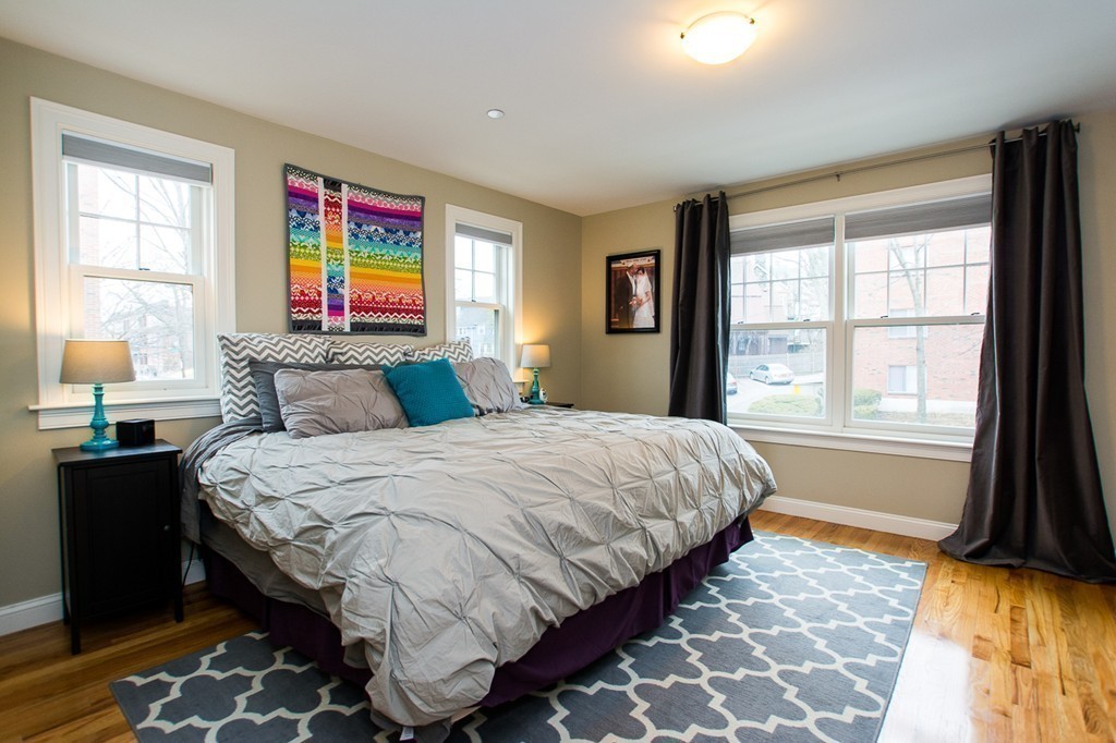 45 Selkirk Road, Unit C Boston, MA 02135 - Photo 9 of 19 a bedroom with a bed and a window