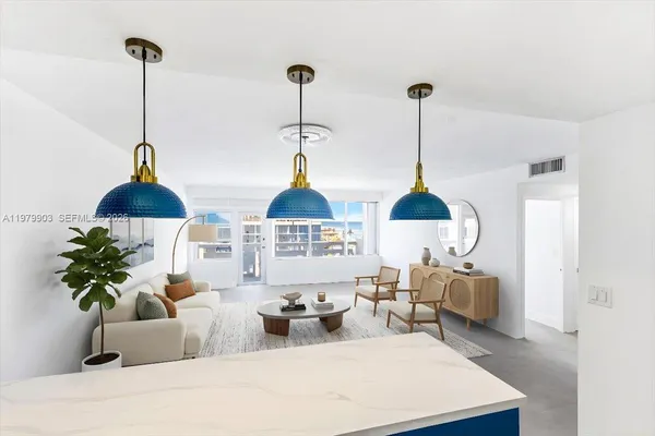 a living room with furniture and a lamp