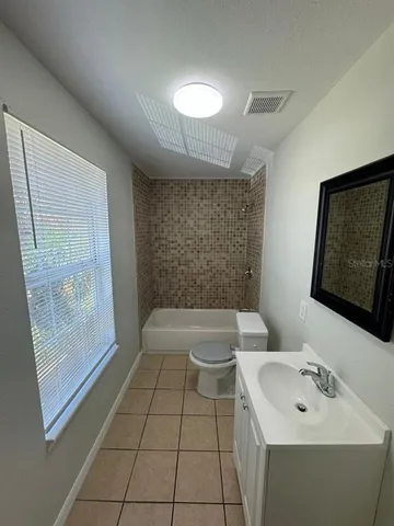 a kitchen with stainless steel appliances a refrigerator and a sink