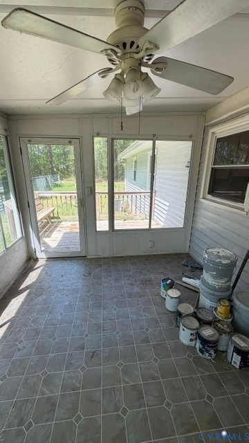 2597 Varney Road Henrico, VA 23231 - Photo 17 of 26 a living room with couches a fireplace and a large window with garden view