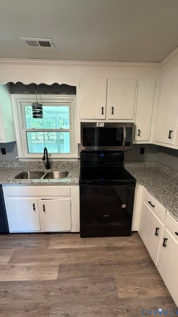 2597 Varney Road Henrico, VA 23231 - Photo 4 of 26 a kitchen with stainless steel appliances granite countertop a stove a sink and a microwave