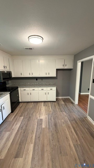 2597 Varney Road Henrico, VA 23231 - Photo 5 of 26 a view of kitchen with wooden floor