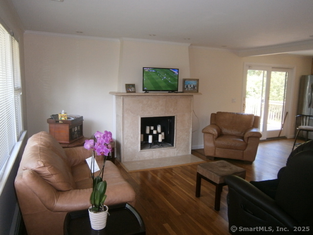 18 Hales Road Westport, CT 06880 - Photo 7 of 26 a living room with furniture and a fireplace