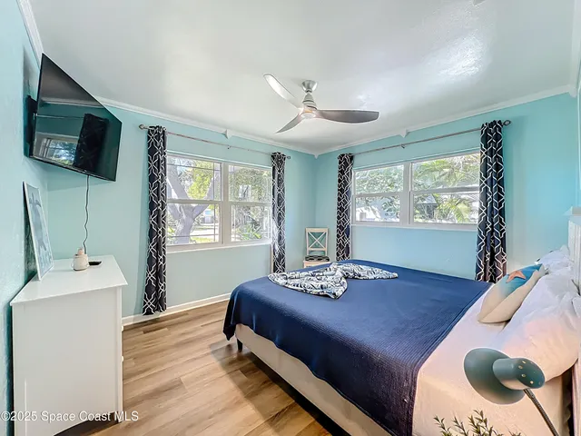 a bedroom with furniture and a window