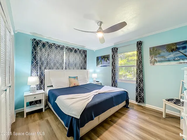 a bedroom with a bed and a table