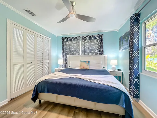 a bedroom with a large bed and a window