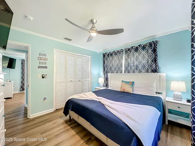 a bedroom with a bed and a table