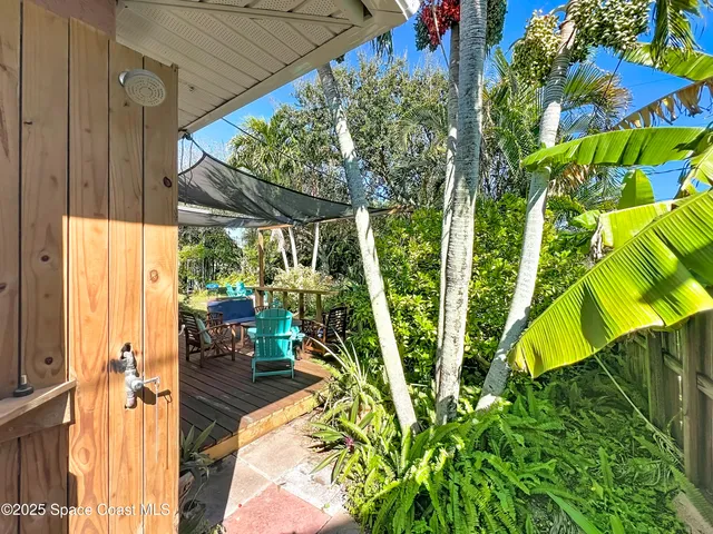 a backyard of a house with outdoor seating