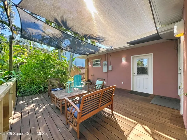 a view of a chairs and table in a patio