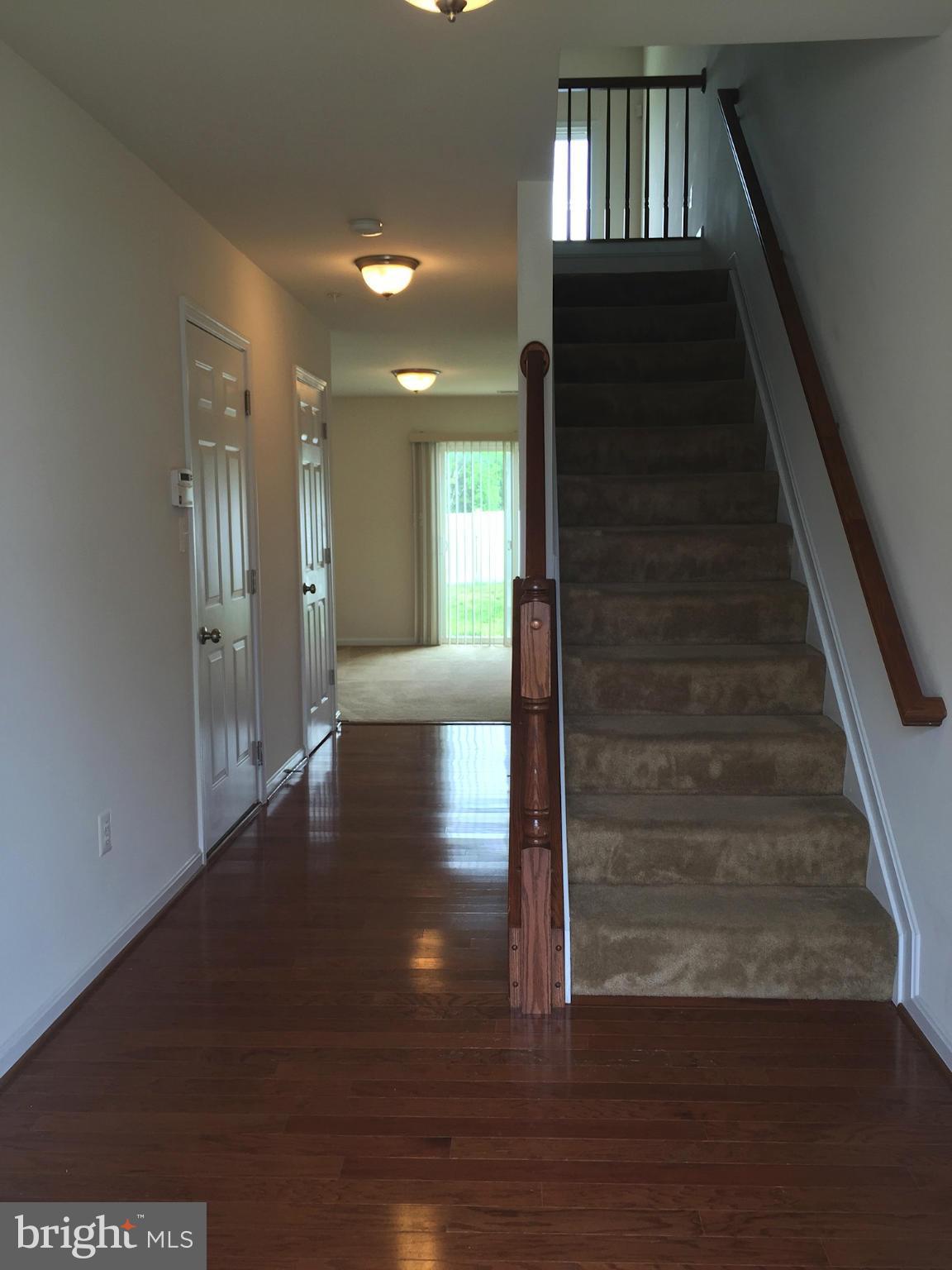 74 Backstretch Way Prince Frederick, MD 20678 - Photo 2 of 21 a view of entryway and hall with wooden floor