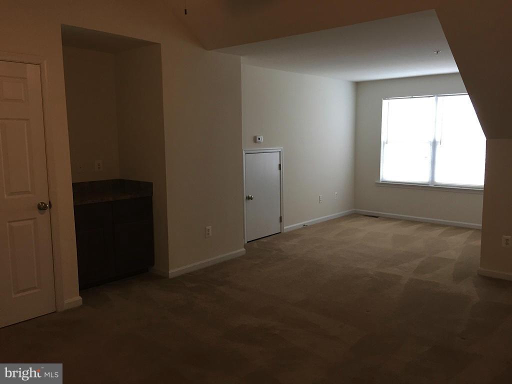 74 Backstretch Way Prince Frederick, MD 20678 - Photo 14 of 21 an empty room that has a window