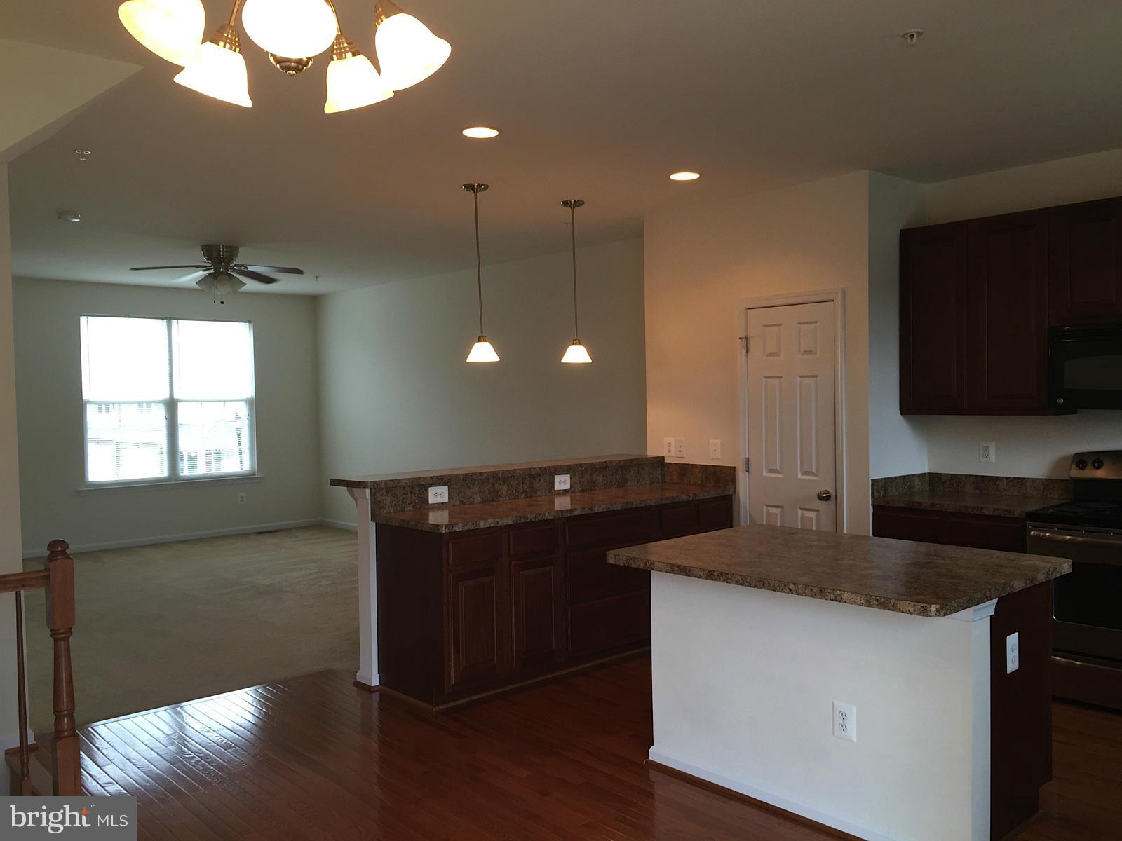 74 Backstretch Way Prince Frederick, MD 20678 - Photo 5 of 21 a kitchen with a sink and a microwave