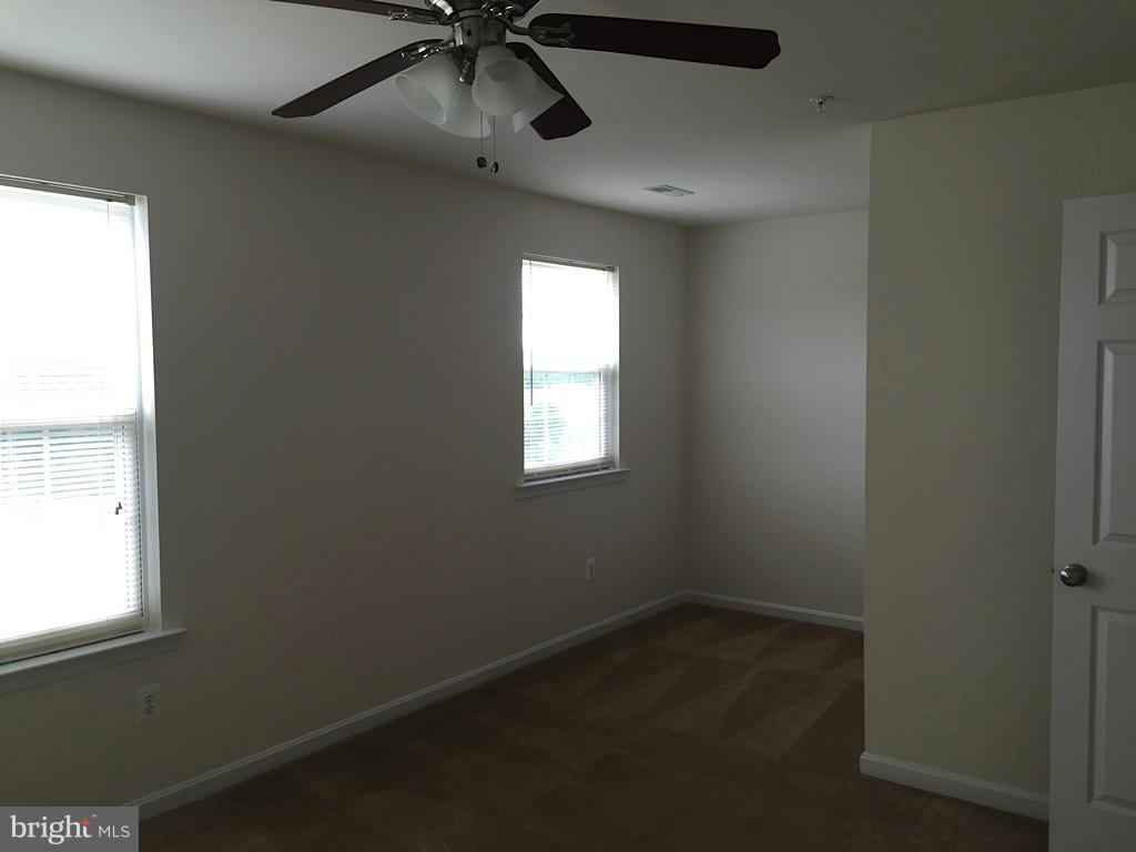 74 Backstretch Way Prince Frederick, MD 20678 - Photo 7 of 21 an empty room with a window