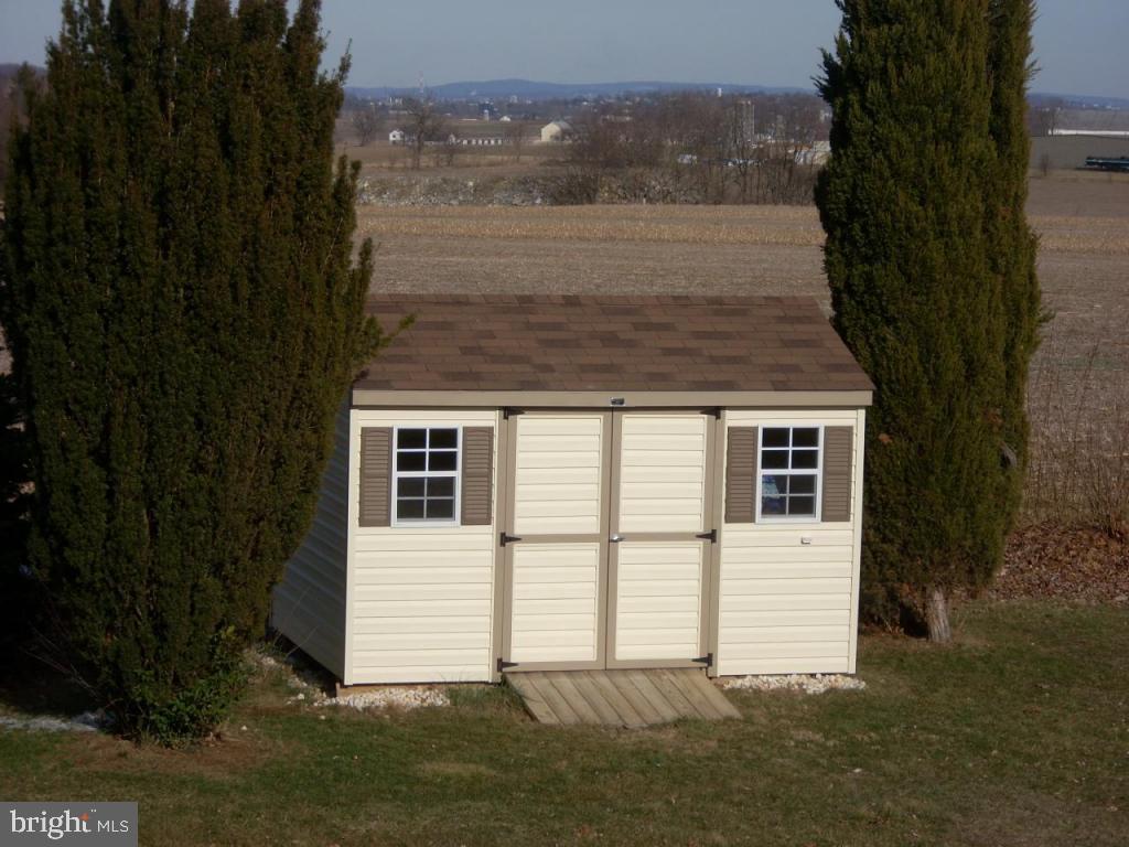 152 April Lane, Unit 17543 Lititz, PA 17543 - Photo 8 of 9 a view of a house with a yard
