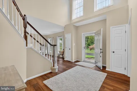 a view of an entryway with wooden floor