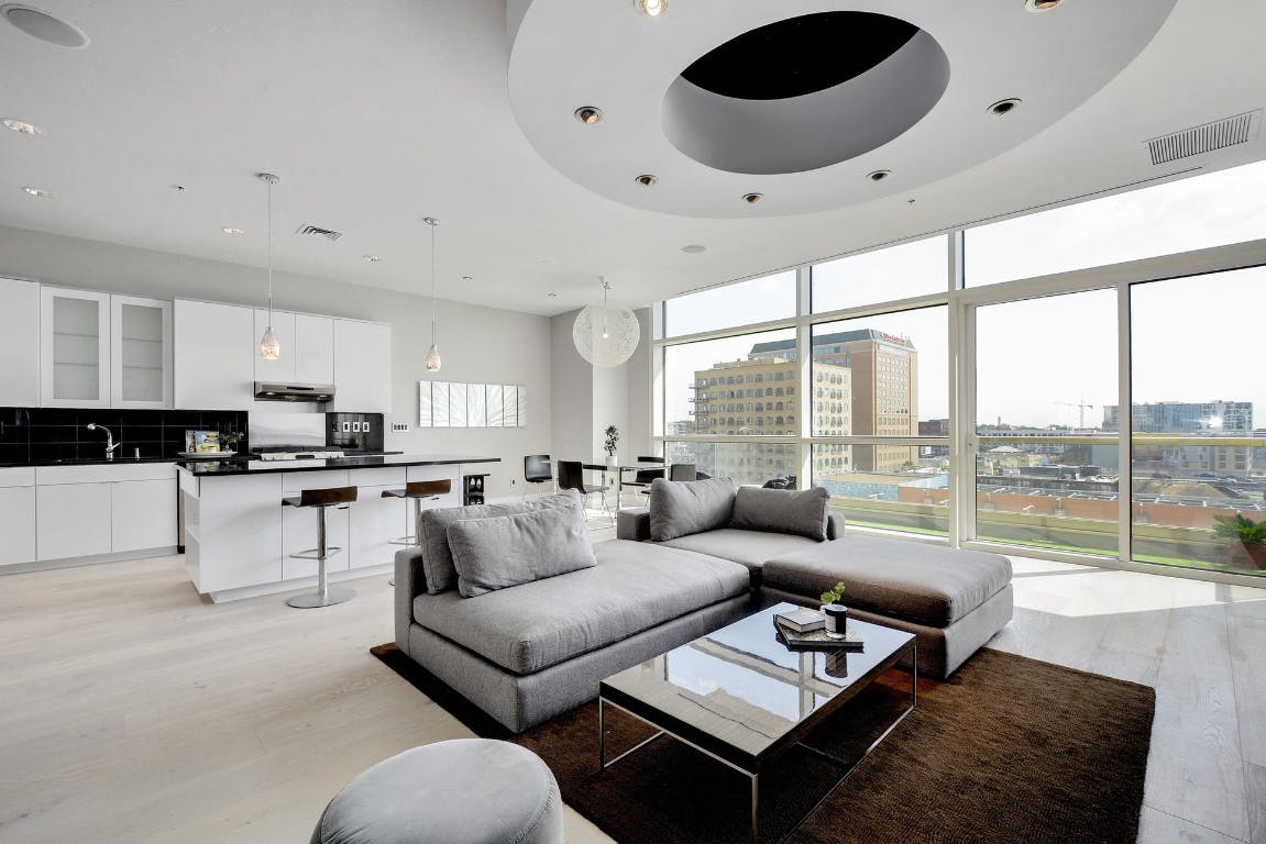 555 East 5th Street, Unit 723 Austin, TX 78701 - Photo 2 of 18 a living room with furniture and a large window