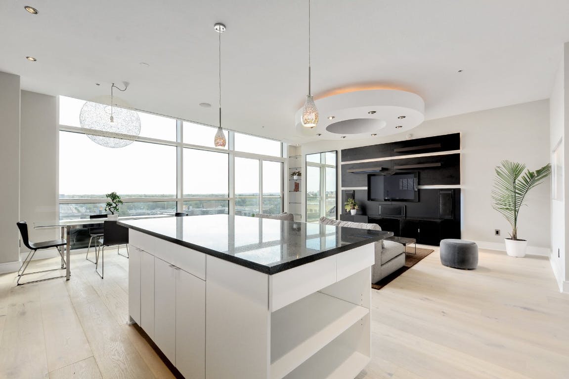 555 East 5th Street, Unit 723 Austin, TX 78701 - Photo 6 of 18 a living room with furniture a chandelier and a flat screen tv