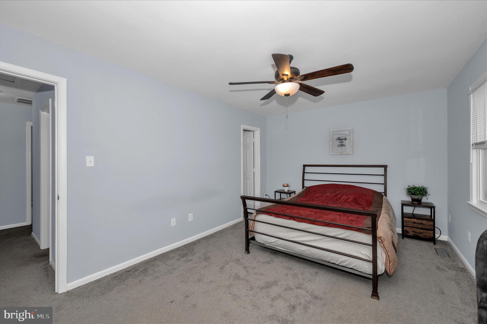 10120 Nightingale Street Gaithersburg, MD 20882 - Photo 24 of 56 a bedroom with a bed and a chandelier fan