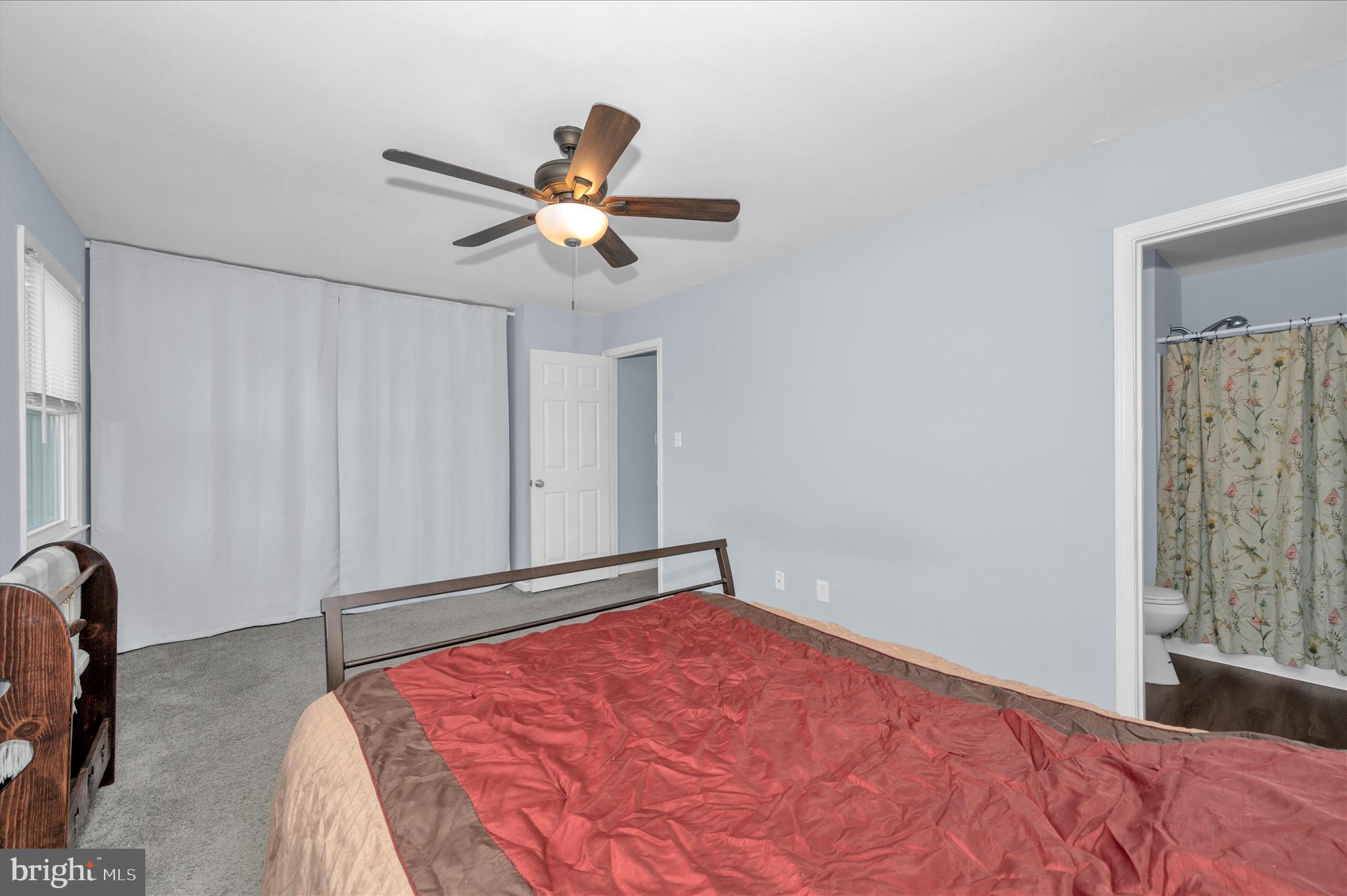 10120 Nightingale Street Gaithersburg, MD 20882 - Photo 25 of 56 a bedroom with a bed and a chandelier