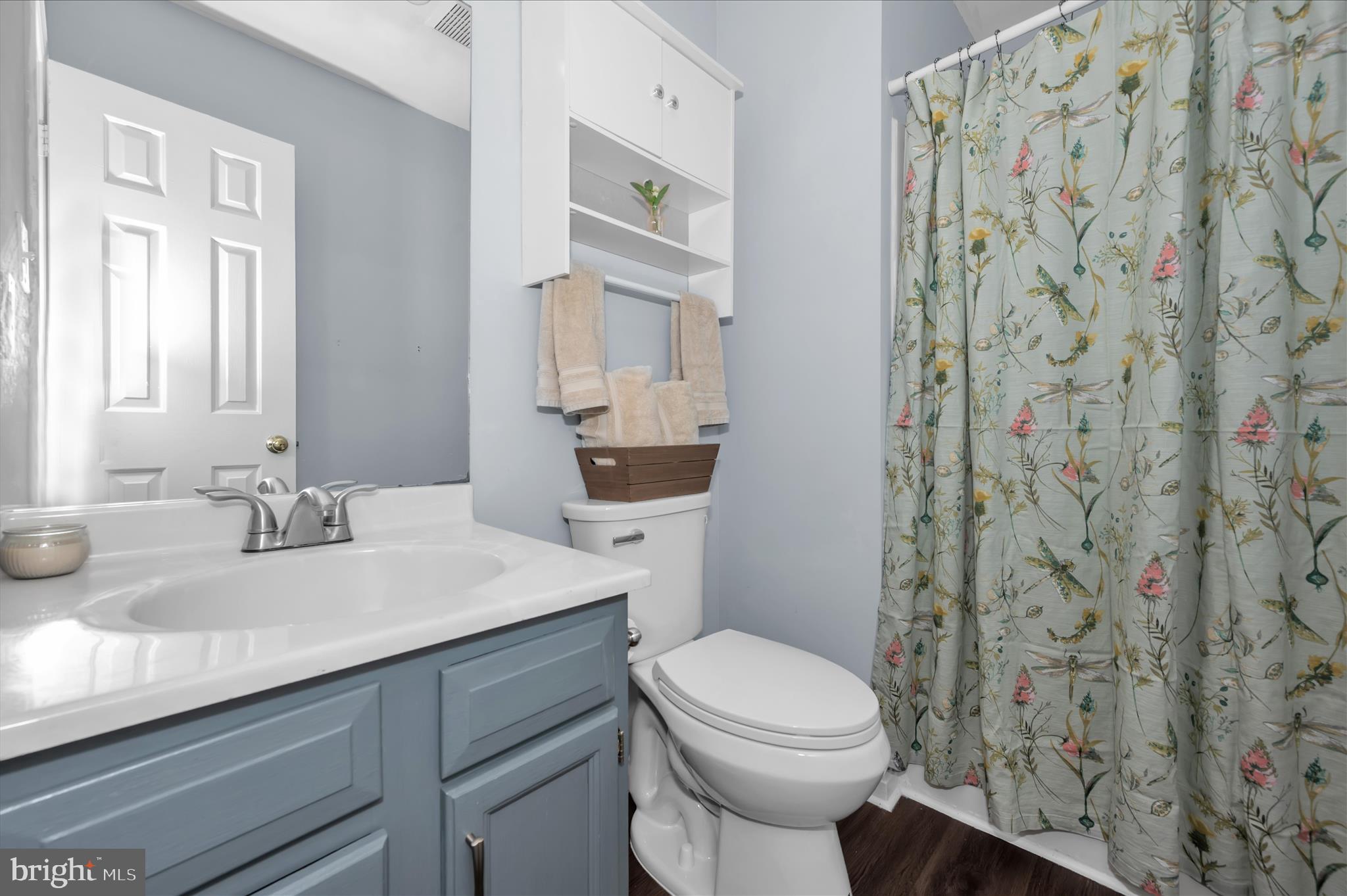 10120 Nightingale Street Gaithersburg, MD 20882 - Photo 27 of 56 a bathroom with a sink a toilet and shower curtain