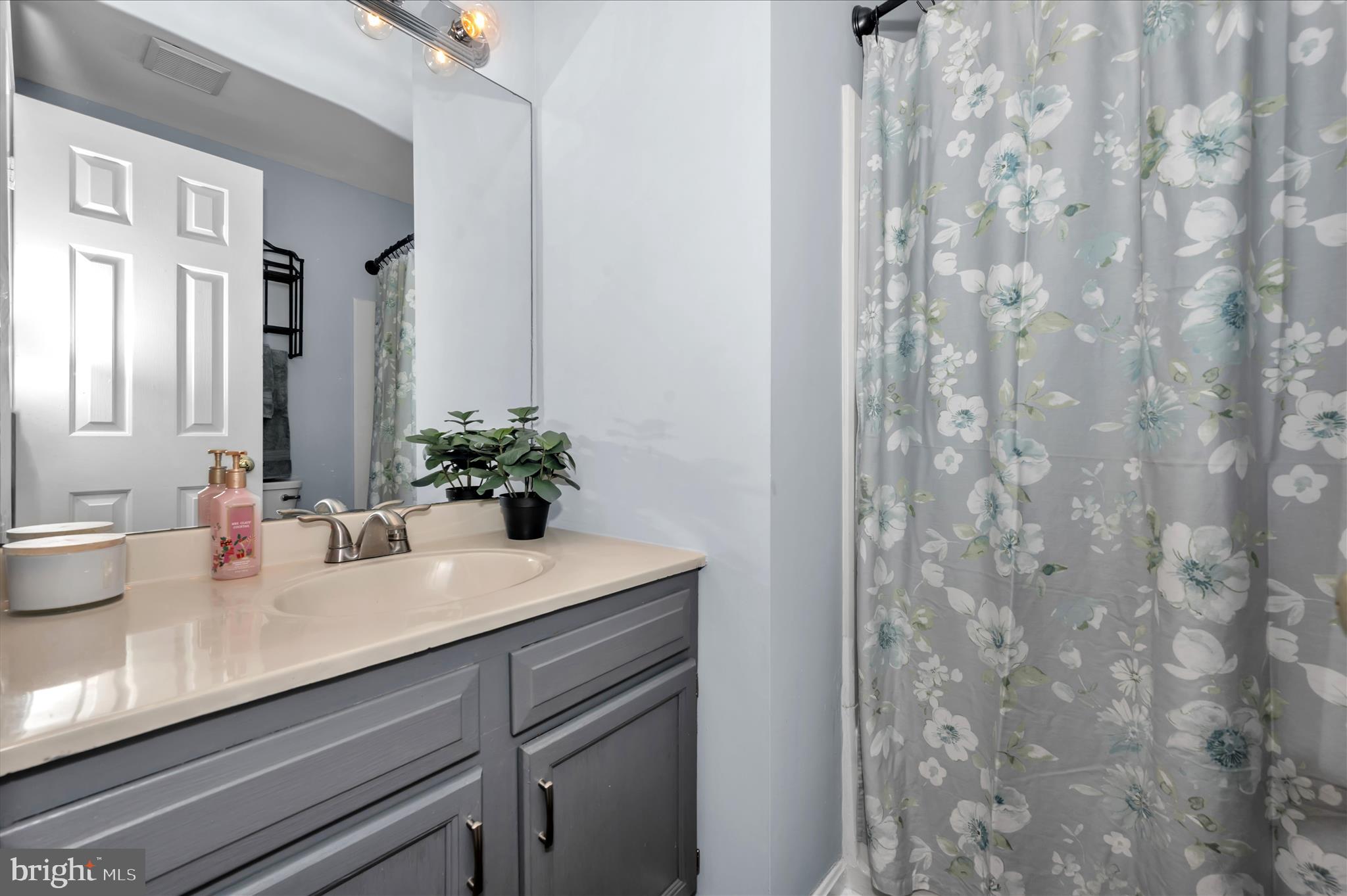 10120 Nightingale Street Gaithersburg, MD 20882 - Photo 33 of 56 a bathroom with a sink and a mirror