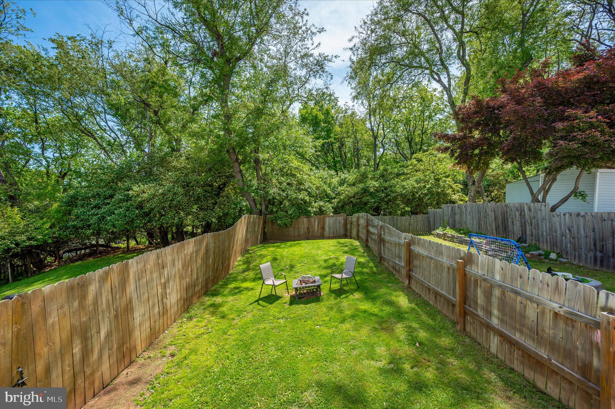 10120 Nightingale Street Gaithersburg, MD 20882 - Photo 47 of 56 a view of a backyard with wooden fence