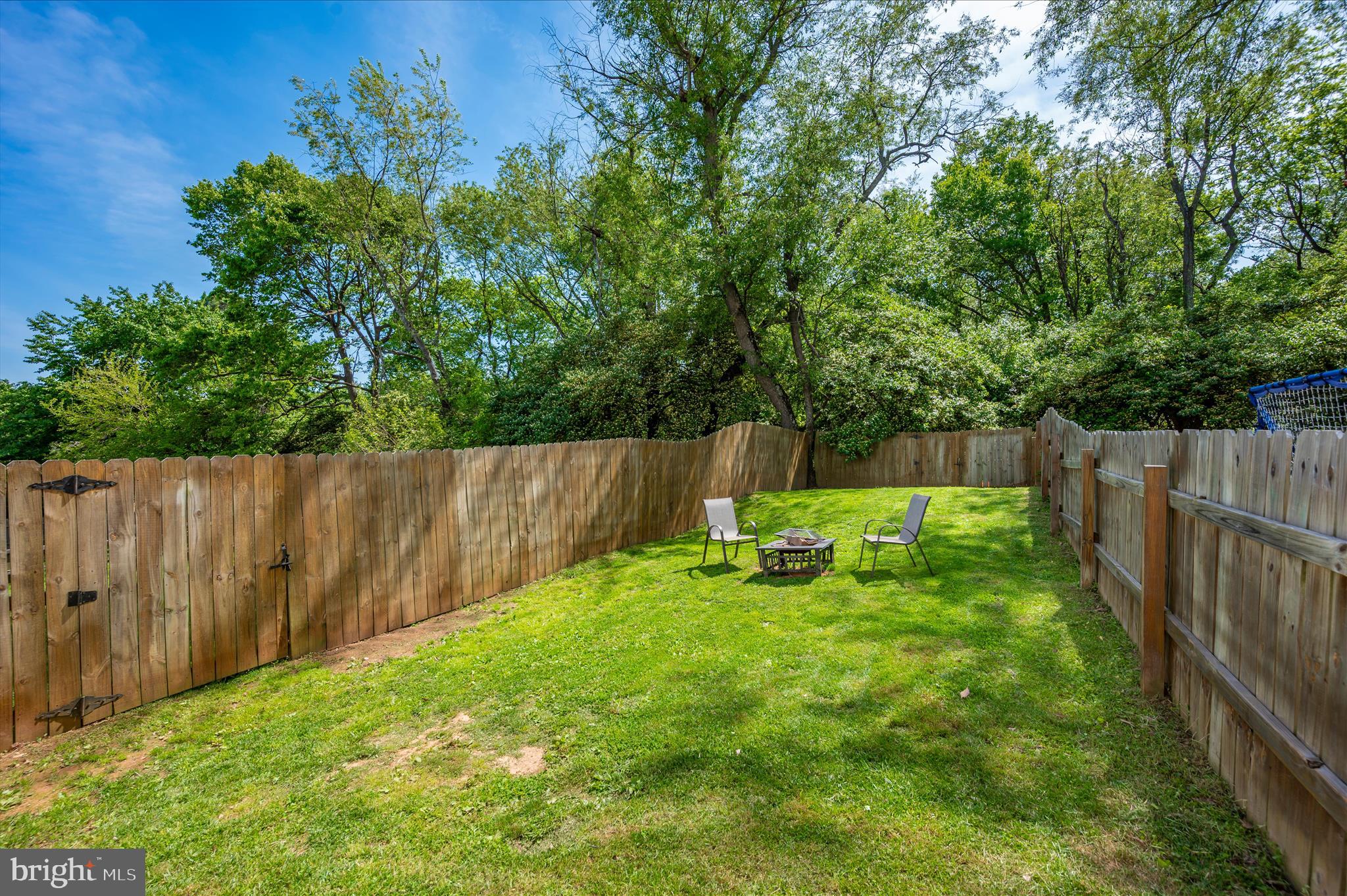 10120 Nightingale Street Gaithersburg, MD 20882 - Photo 48 of 56 a view of a backyard with a fence and plants