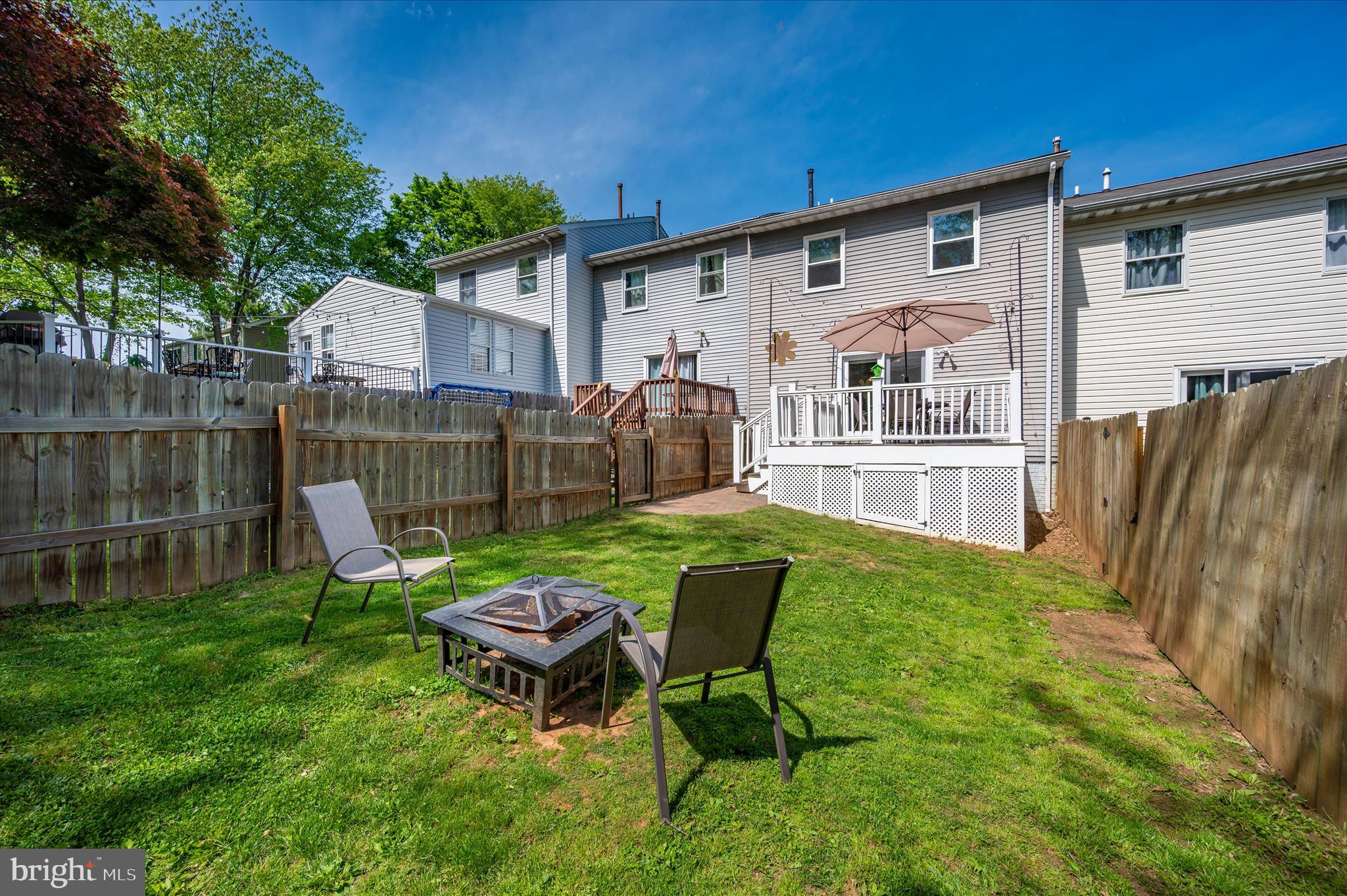 10120 Nightingale Street Gaithersburg, MD 20882 - Photo 51 of 56 a backyard of a house with table and chairs