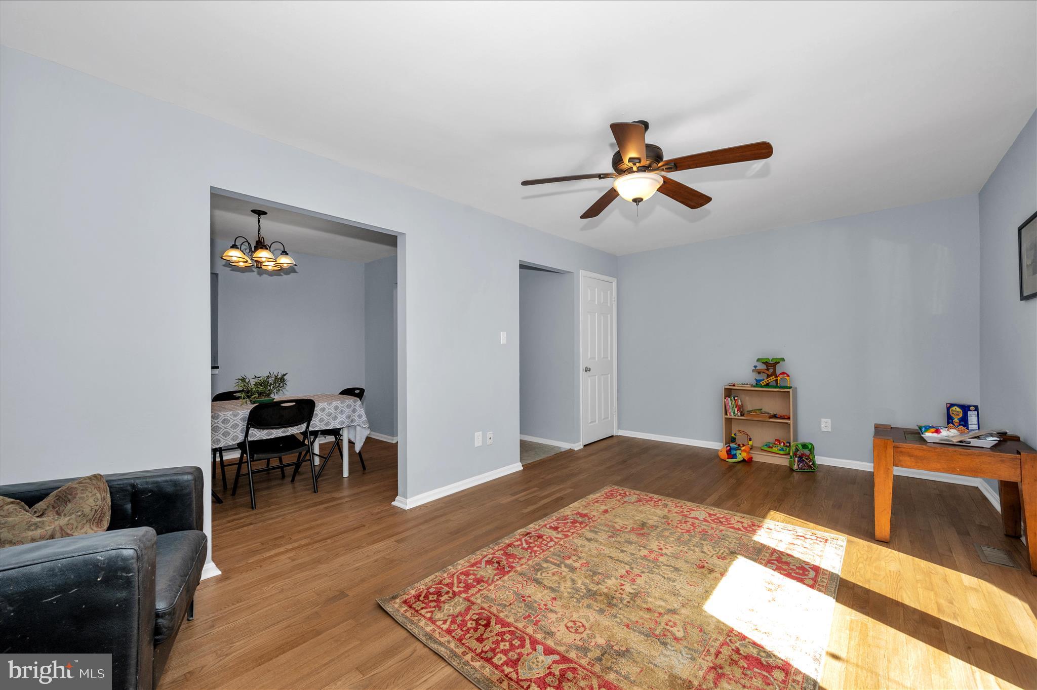 10120 Nightingale Street Gaithersburg, MD 20882 - Photo 9 of 56 a bedroom with furniture and a wooden floor