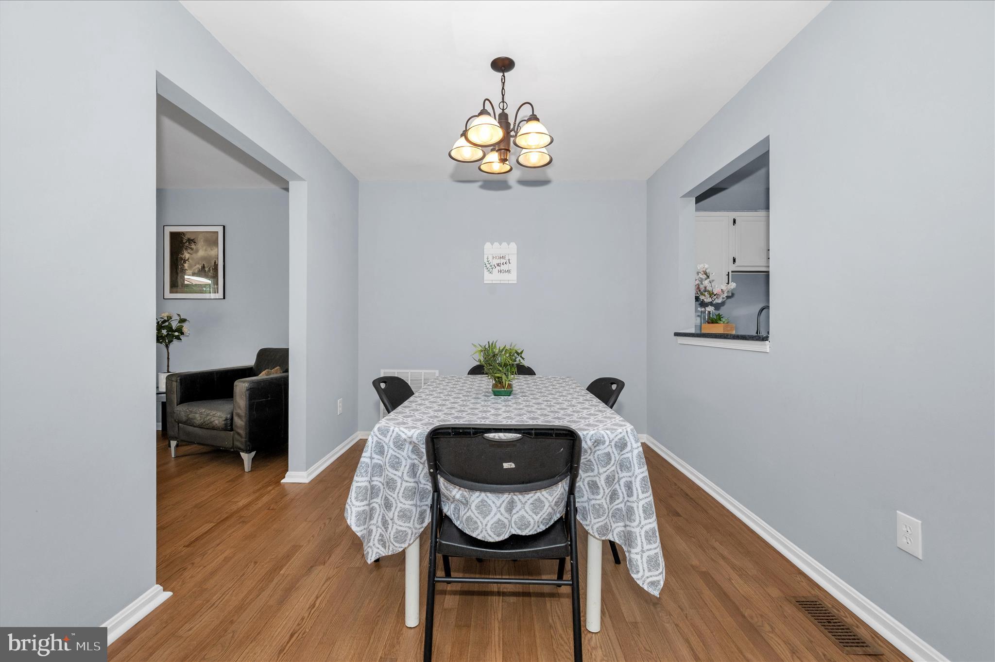 10120 Nightingale Street Gaithersburg, MD 20882 - Photo 10 of 56 a dining room with furniture and wooden floor