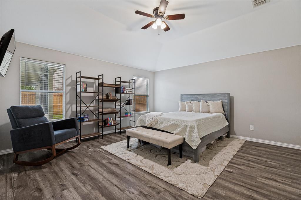 4305 Ridgewood Road Melissa, TX 75454 - Photo 13 of 26 Vaulted ceiling with a ceiling fan, wood-finish flooring, and multiple windows providing natural light
