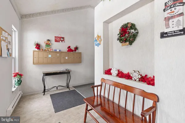 a bedroom with furniture and wooden floor