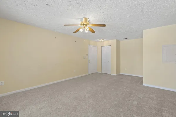 a view of a chandelier fan in a room