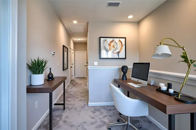 a view of a workspace with furniture