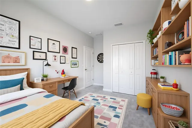 a bed room with a bed and a desk