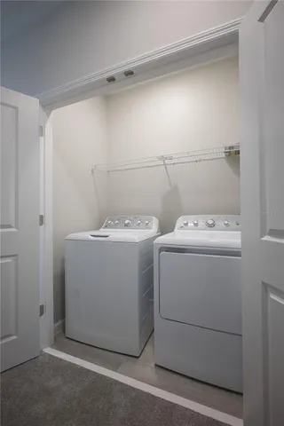 a utility room with dryer and washer