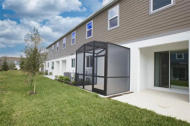 a view of a back yard of the house