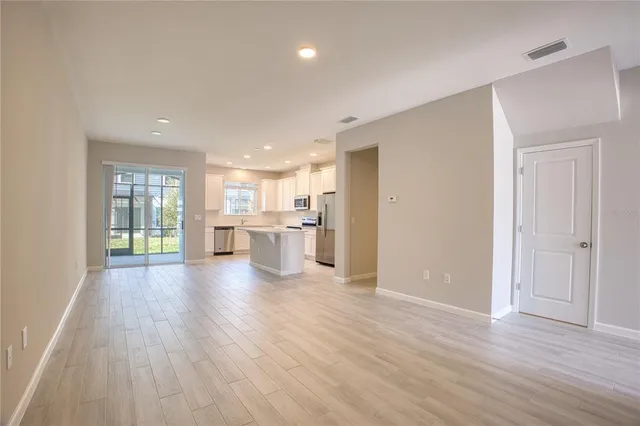 a view of kitchen with wooden floor
