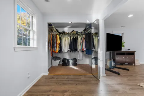 a view of livingroom with hardwood floor and cabinet