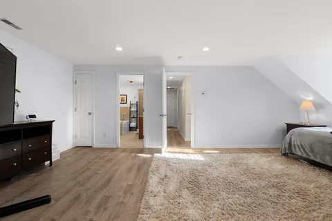 a bathroom with a granite countertop sink a toilet and bathtub